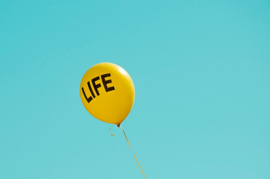 yellow life-printed balloon